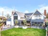rear of the property with a Juliet balcony on one side and large balcony on the other. ground floor has lots of glazing and large bifold doors